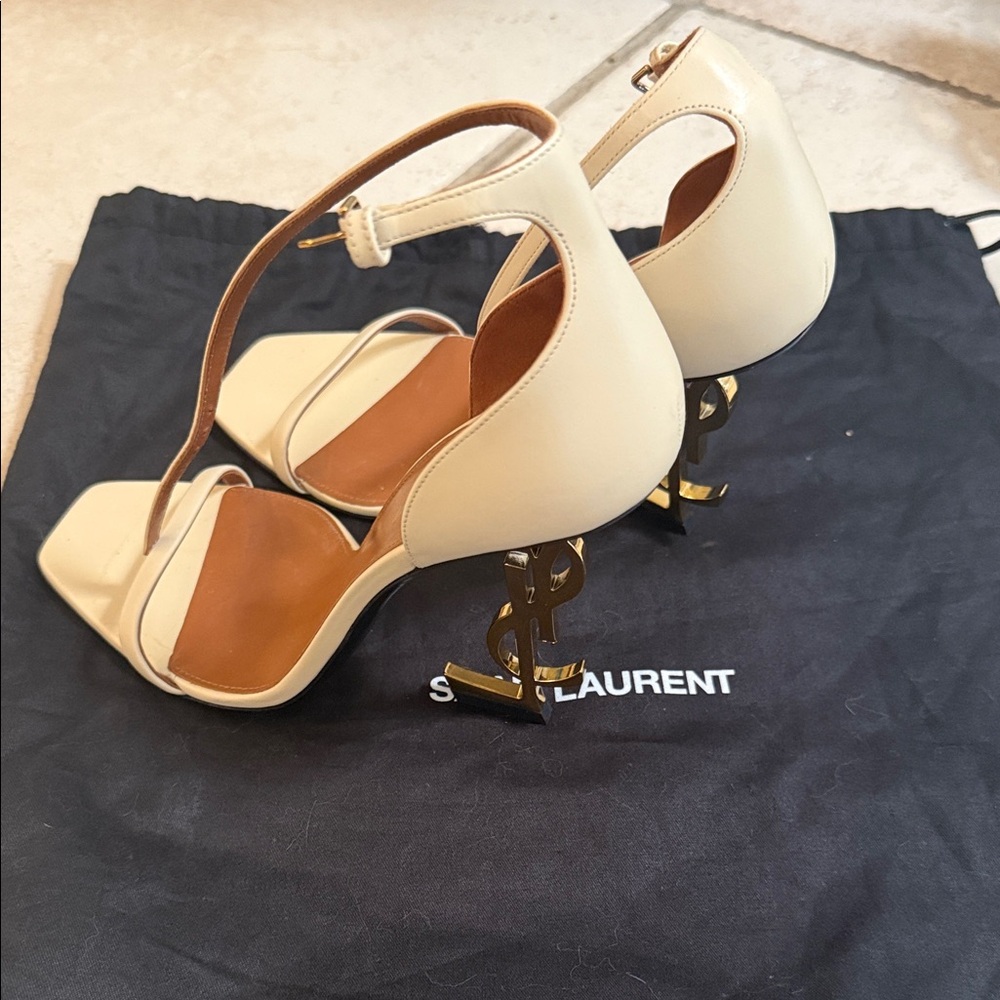 Never worn Saint Laurent Cream Heels with Gold YSL logo